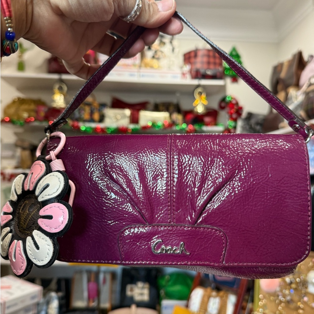 Coach Fuchsia Leather Wristlet with Floral Charm charm is no included it